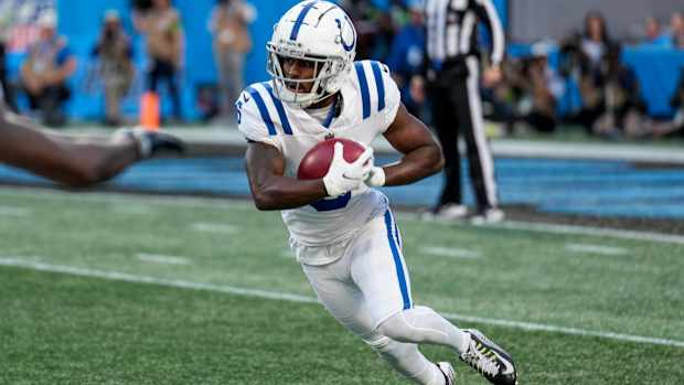 Nov 5, 2023; Charlotte, North Carolina, USA; Indianapolis Colts wide receiver Isaiah McKenzie (6) returns the kick off during the first quarter against the Carolina Panthers at Bank of America Stadium.